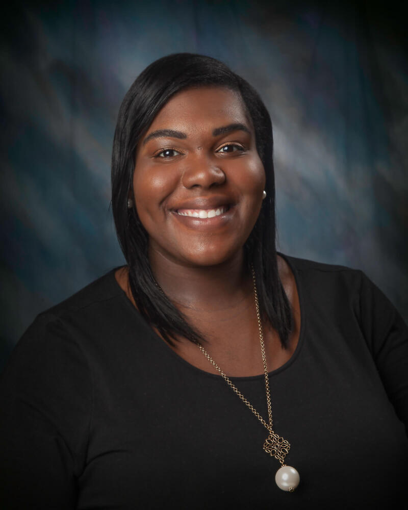 Courtney Echols smiles for a more formal headshot. 