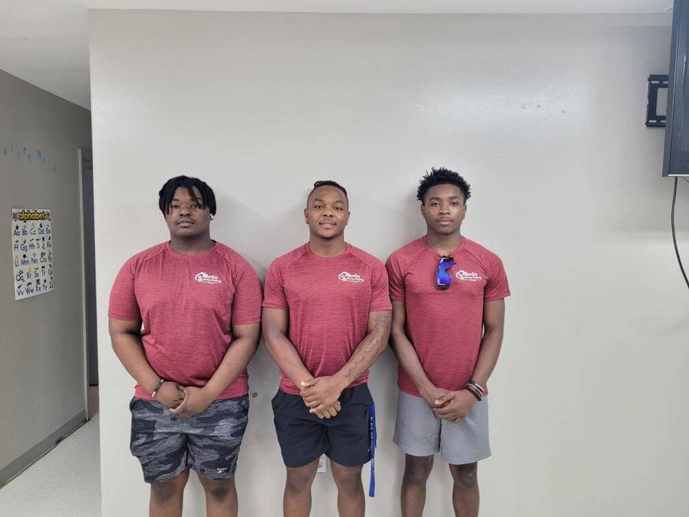 Three Boys smiling and posing 