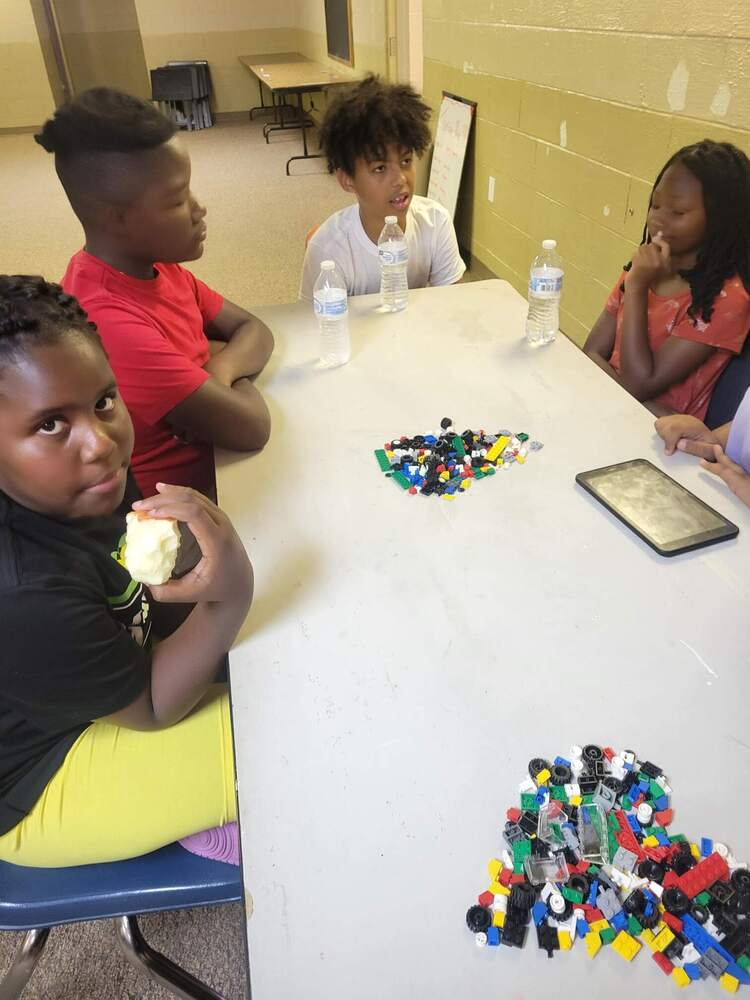 A group of children playing with legos