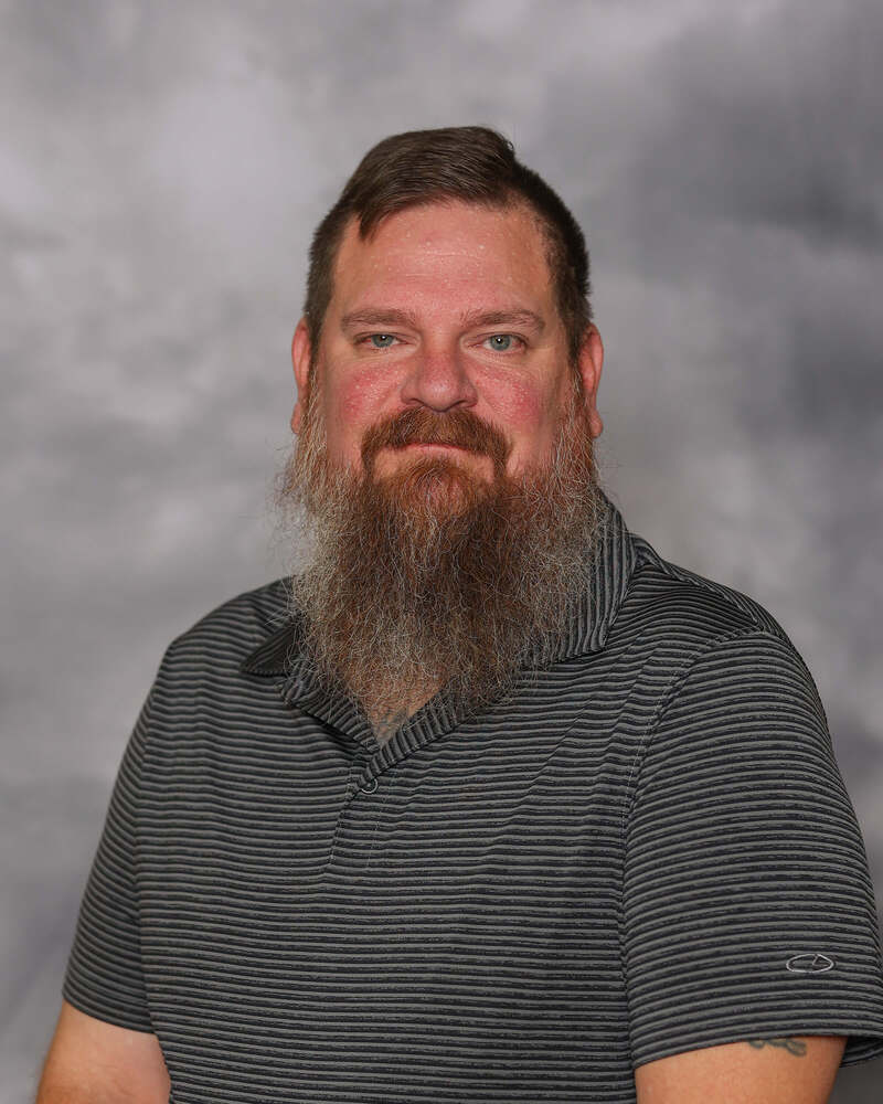 Ben West gives a small smile for his headshot.