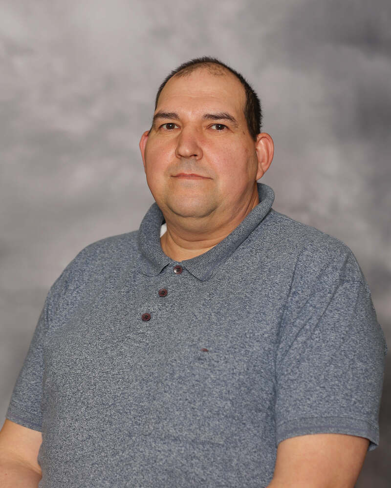Valentin Leucian looks into the camera for his headshot.