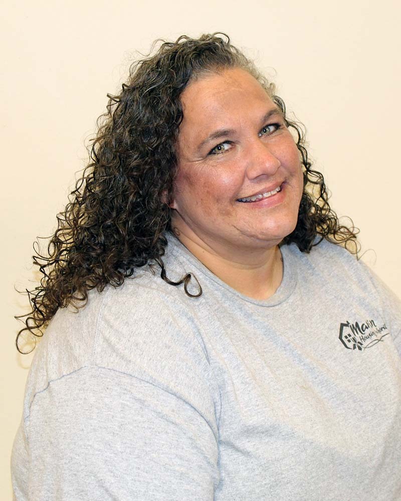 Erin Shanklin smiles a small, cute smile for her headshot.